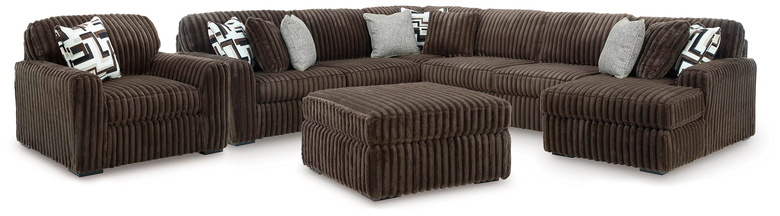 60c50fb7ebdc6989efba3fc12b1903c5 Midnight-Madness 4-Piece Sectional with Chaise, Oversized Chair and Ottoman - Image 1