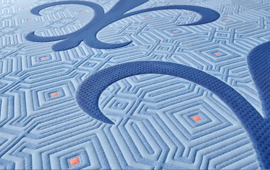 Close-up of a light blue textured mattress cover pattern.