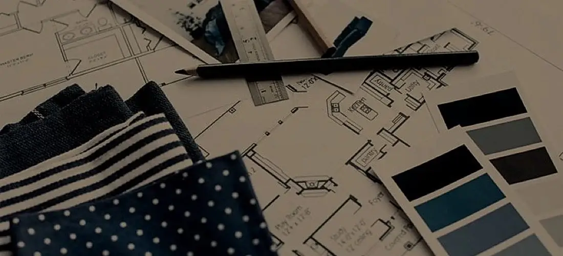 Fabric swatches and paint chips on a floor plan